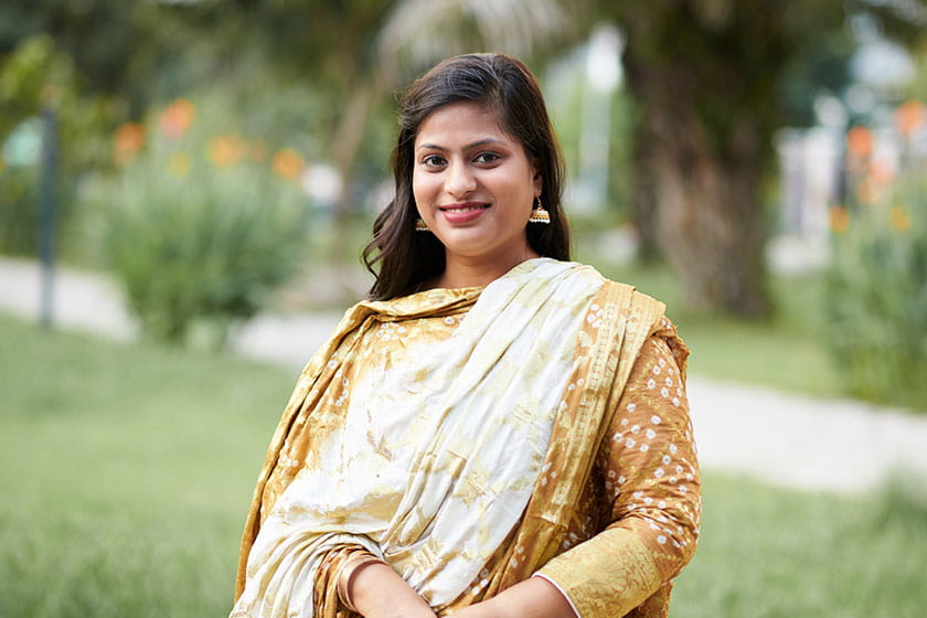 Smiling Indian woman in kurta and dupatta